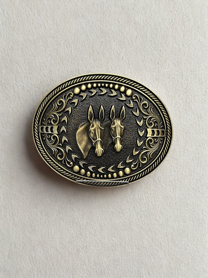 Mule belt buckle front view showing two mules and intricate design around border.