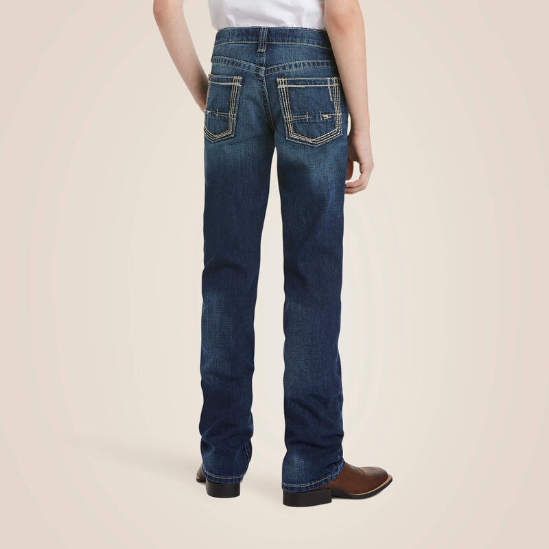 Boy's Ariat B5 Slim Fit jeans in a dark wash. Rear view showing stitching on pockets.