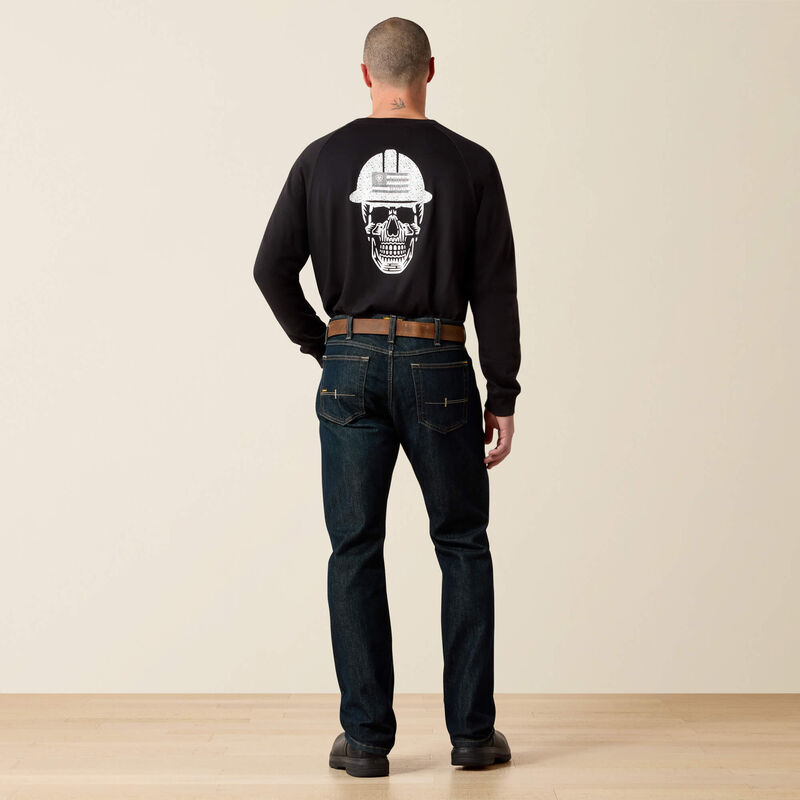 Men's Ariat Rebar M7 slim straight work jeans, in Blackstone a dark wash. Rear view showing jeans on a model.
