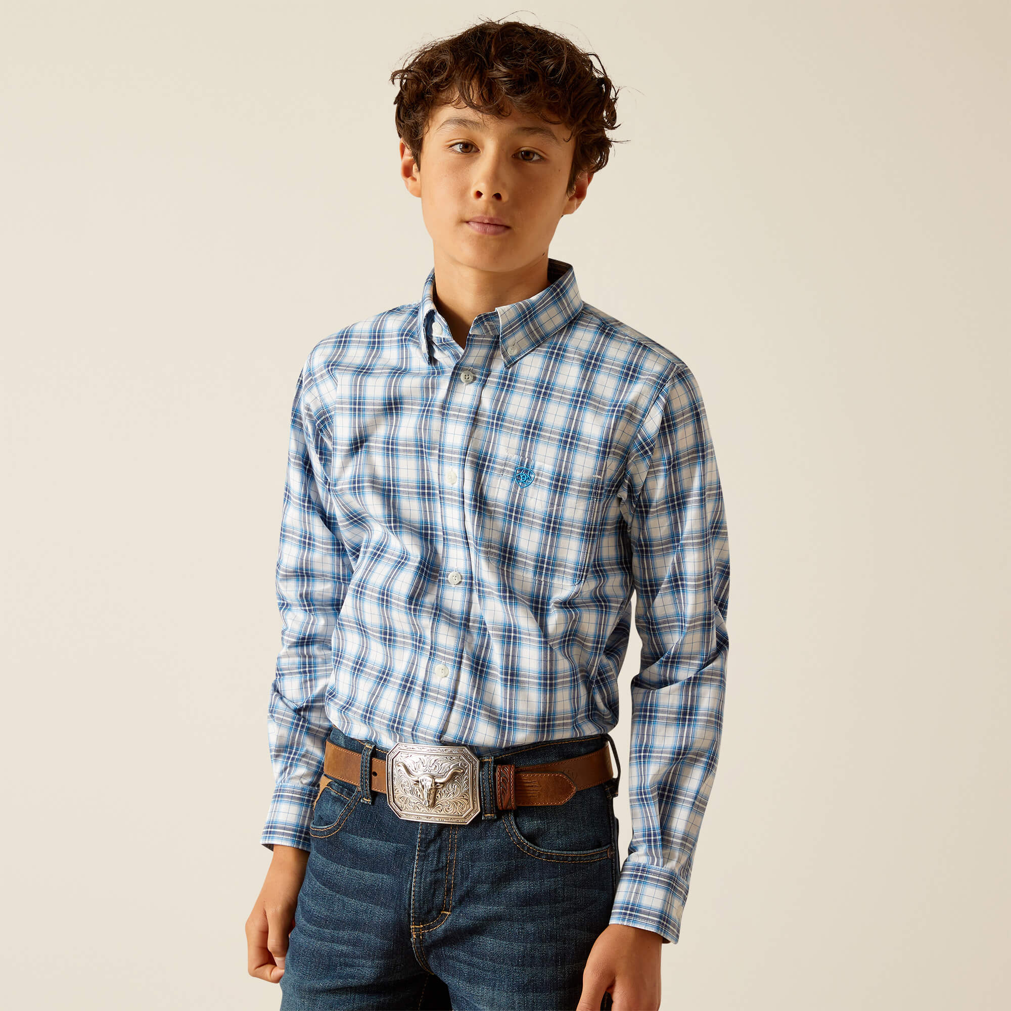 Boy's Ariat long sleeve Pro Series shirt in Blue Plaid. Front view showing shirt tucked in.