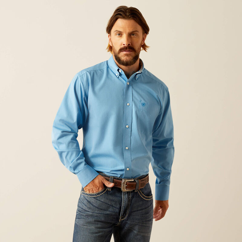 Men's Ariat long sleeve wrinkle free shirt in Blue. Front view showing shirt tucked in.