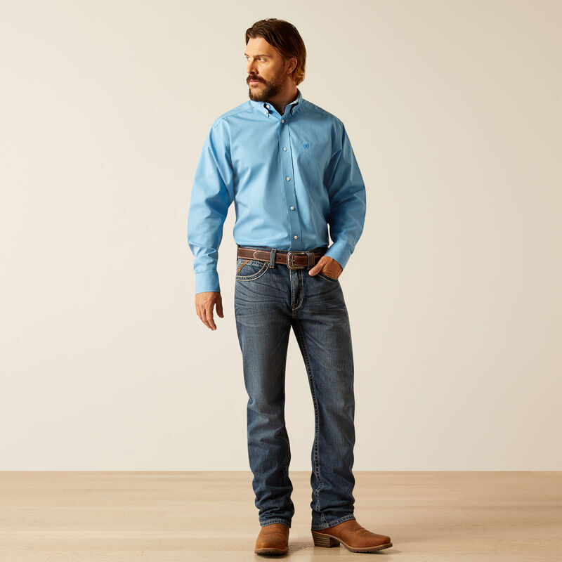 Men's Ariat long sleeve wrinkle free shirt in Blue. Full front view showing shirt tucked in.