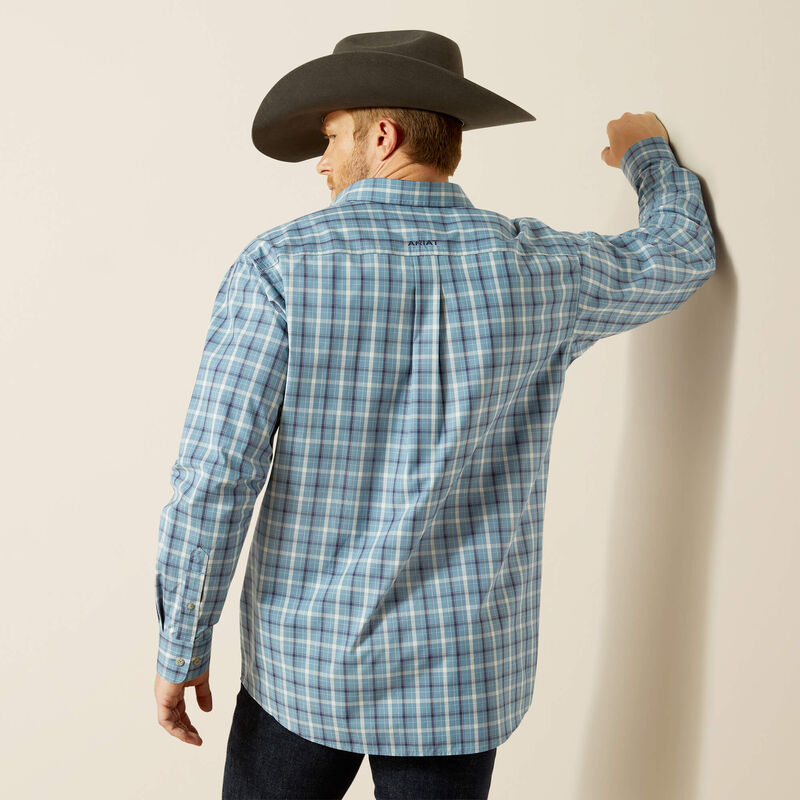 Men's Ariat long sleeve button up shirt in Blue Plaid. Rear view shirt untucked.