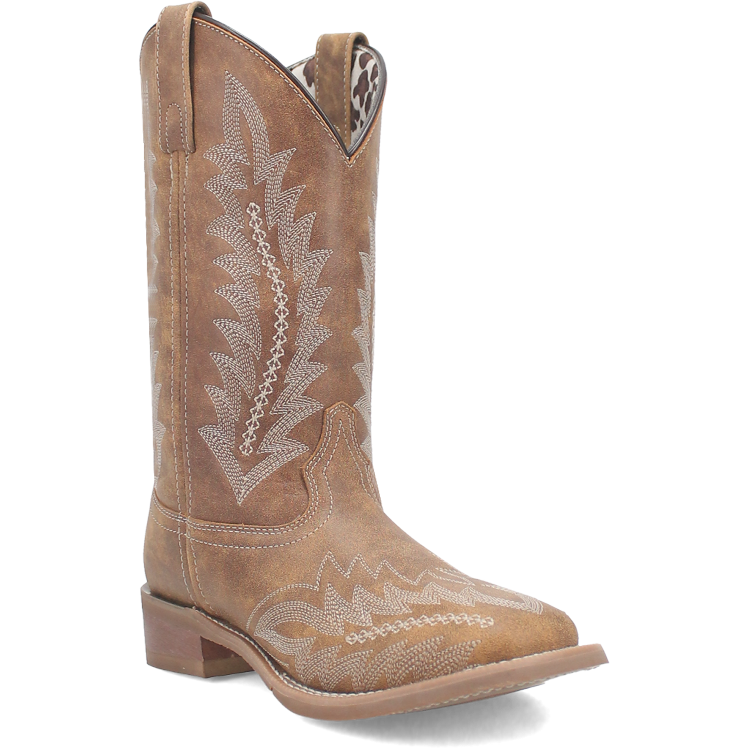 A profile view of a women's tan leather boot with a square toe and floral stitch detailing.