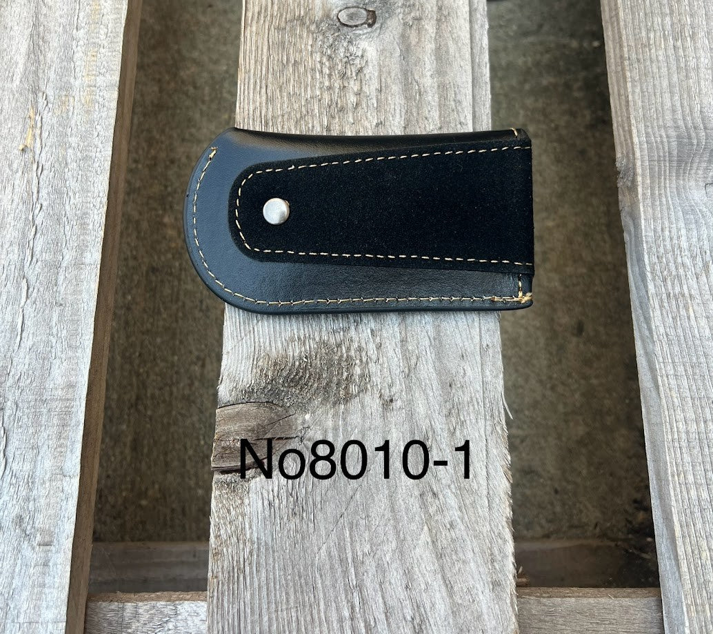 This Black leather knife sheath from Top Notch Accessories features an embossed Praying Cowboy design. Rear view showing leather belt attachment.