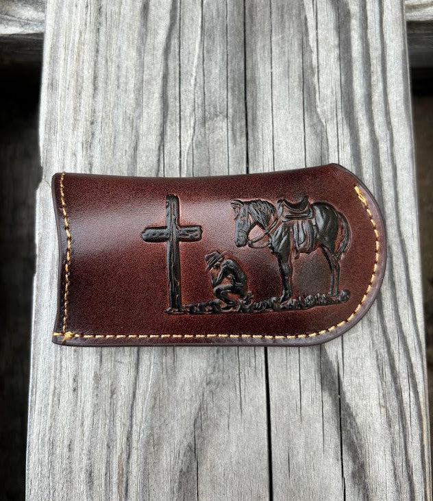 This Coffee Brown leather knife sheath from Top Notch Accessories features a embossed praying cowboy design. Front View
