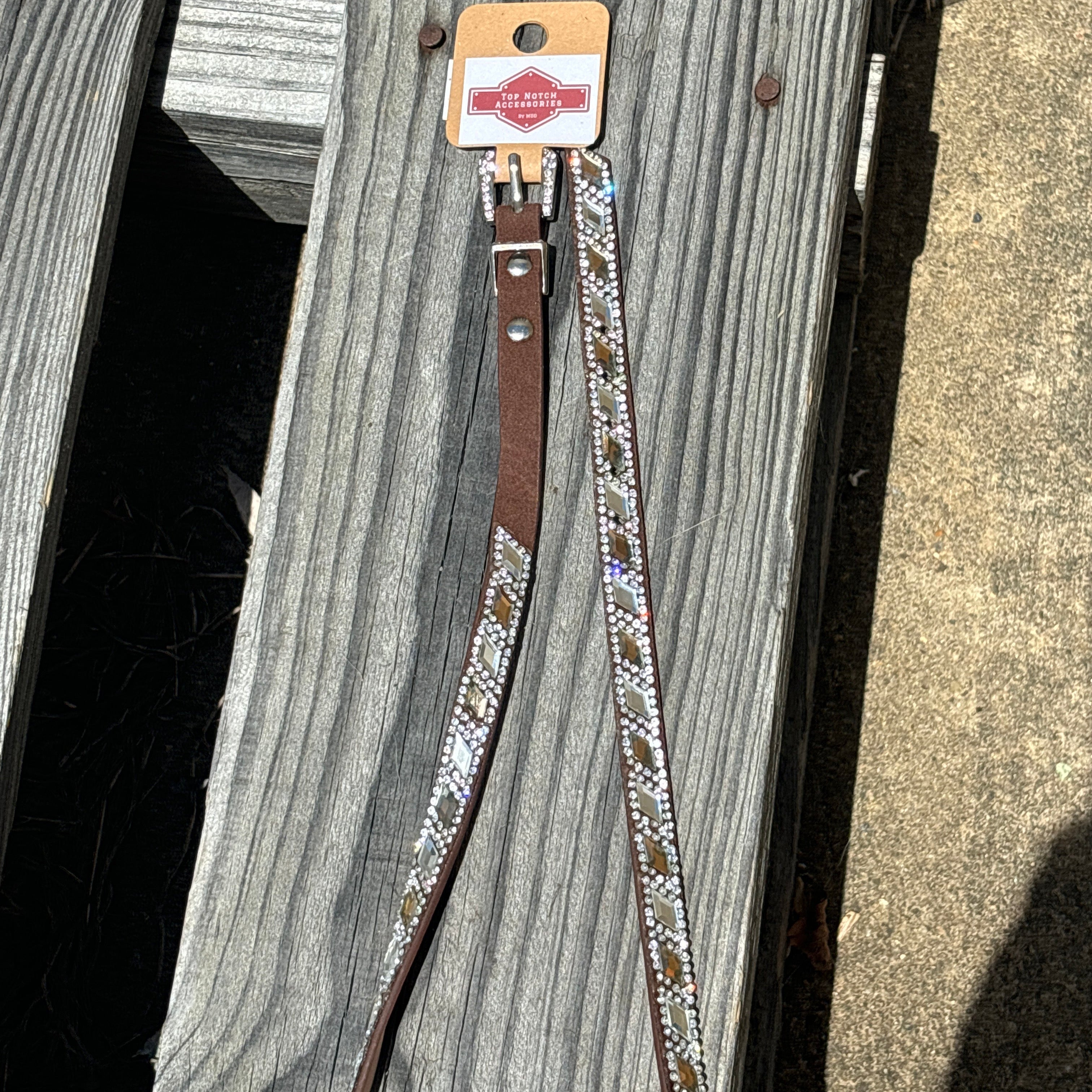 Western style hat band with Brown and Clear diamond shaped alternating crystals. Features a crystal studded buckle for a adjustable fit.
