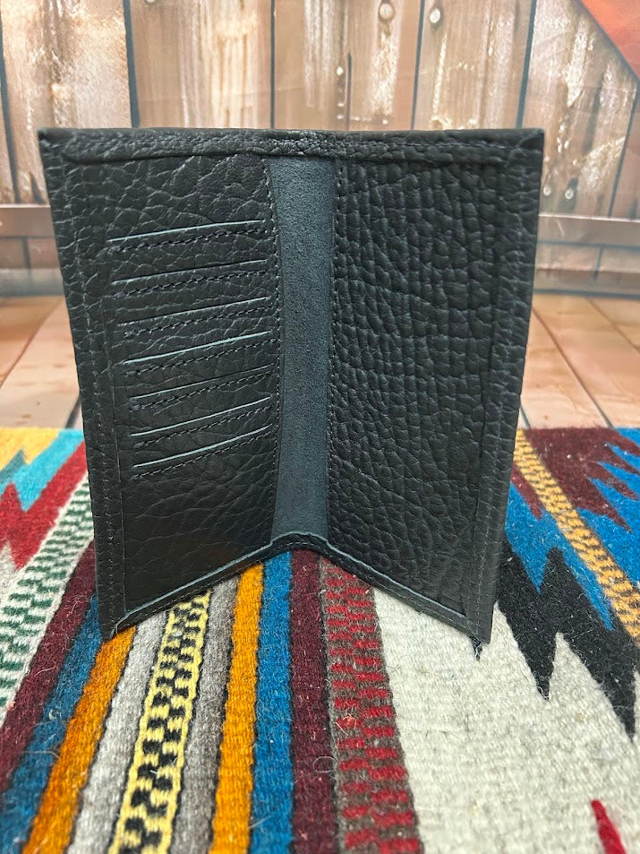 Interior of black tall wallet showing card slots on one side, checkbootkspace on the other.
