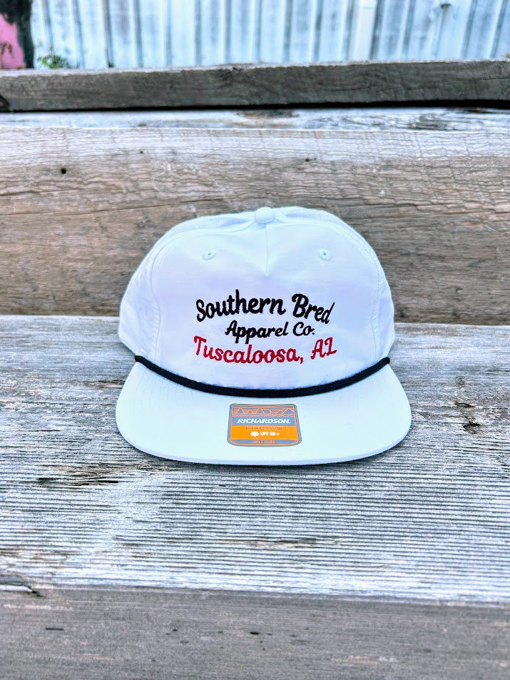 Southern Bred Apparel Co Tuscaloosa, AL white cap with black rope.
Front View