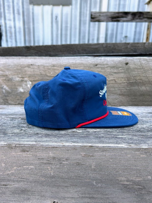 Southern Bred Apparel Co Oxford, MS navy cap with red rope.
Side View