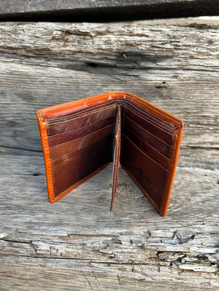 This Light Brown leather bifold wallet features a intricate tooled pattern over a Beige inlay. Inside view showing multiple card slots and a dual ID window.