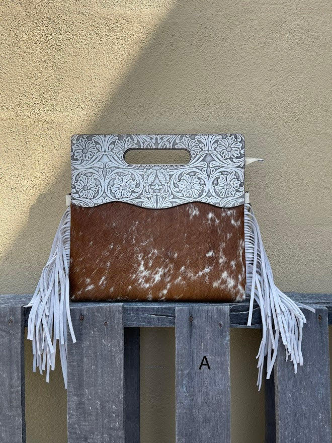 Cowhide and Beige tooled leather purse with fringe. This bag can be carried by handle or removable adjustable strap. Front View A