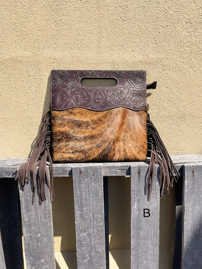 Cowhide and Coffee Brown tooled leather purse with fringe. This bag can be carried by the handle or the removable, adjustable strap. Front View B