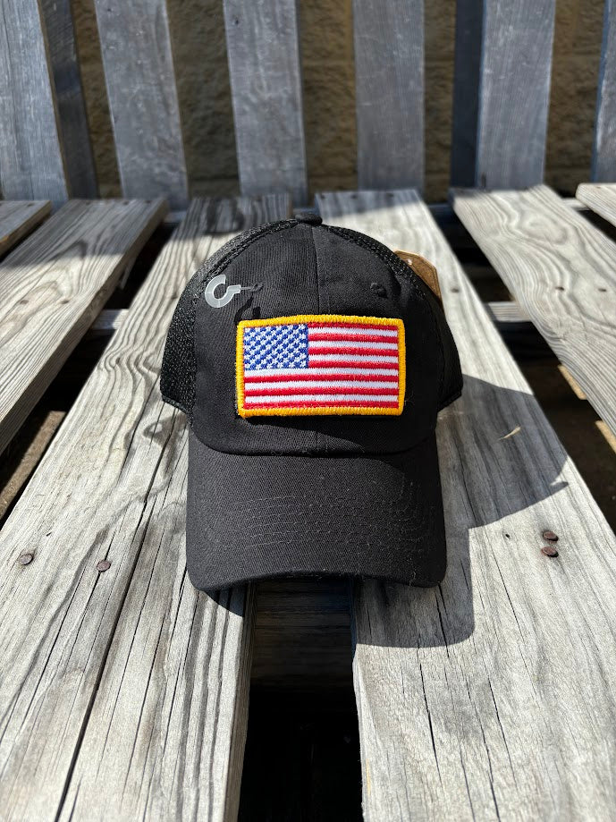 A Back mesh back cap with an American flag patch on the front. Front View