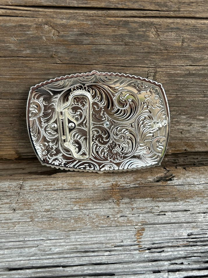 This matte black buckle features a Virgin de Guadalupe design with a intricate Silver border. Rear View