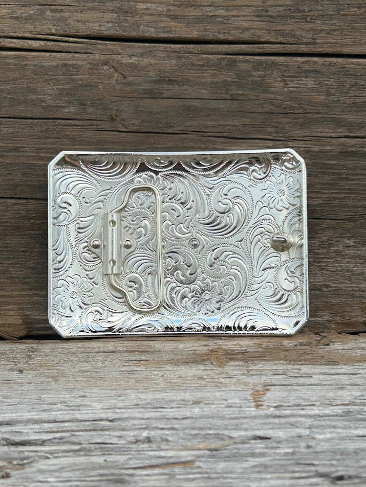 This mixed metal buckle features a Gold Praying Cowboy design on a Silver rectangle featuring a Gold and Black border. Rear View