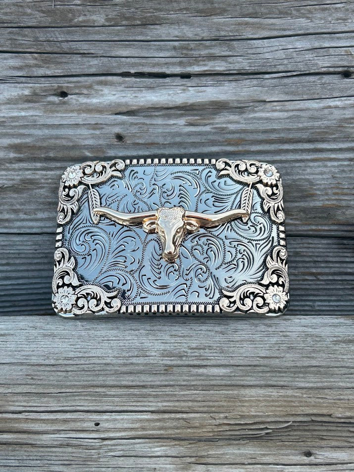 This buckle features a Gold Longhorn design on a Silver background. Front View