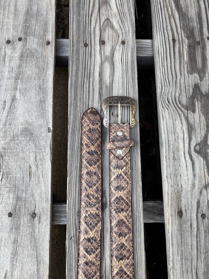 Natural rattlesnake print belt showing removable buckle and belt tip.