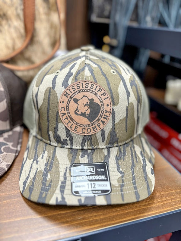 Mississippi Cattle Company “MCC #11” Caramel Leather Patch Adjustable Snap Back Cap In Mossy Oak Bottomland