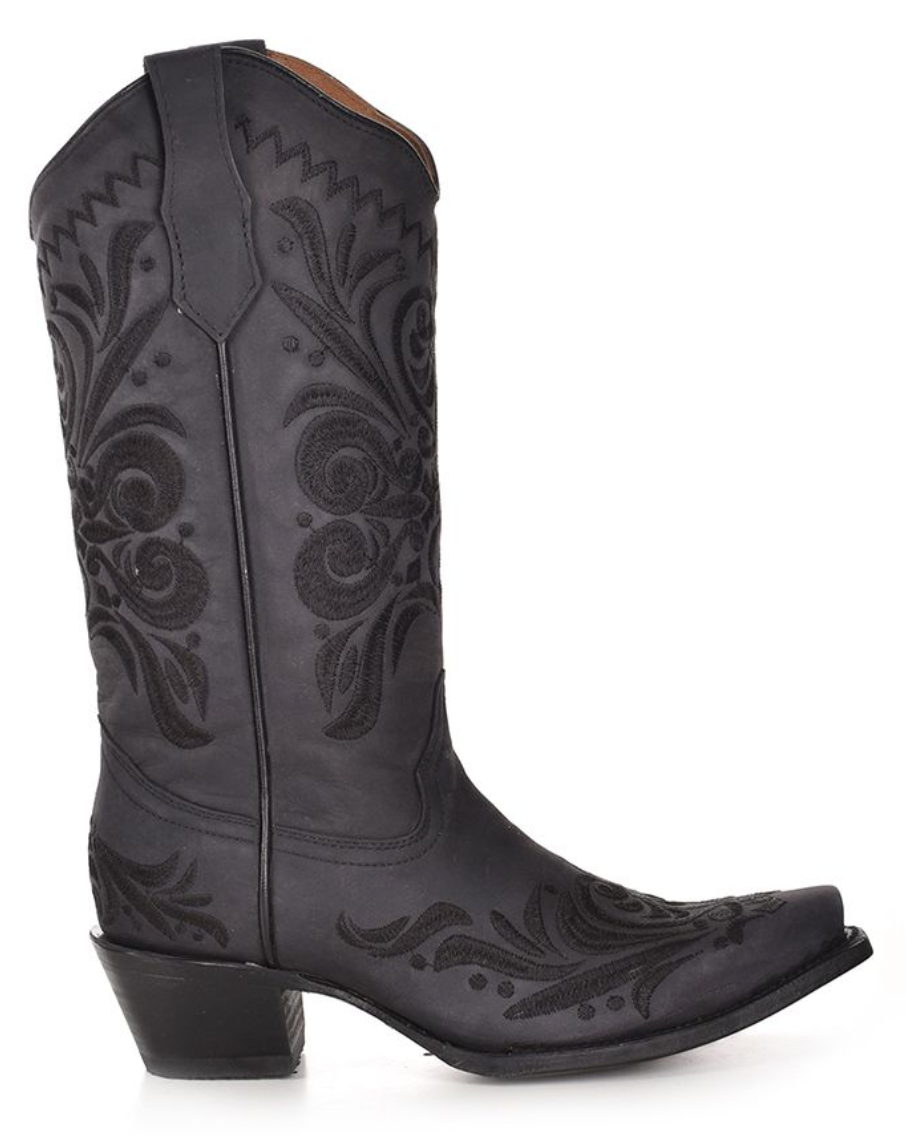 Side view of a black snip toe western boot with black floral embroidery stitching boot