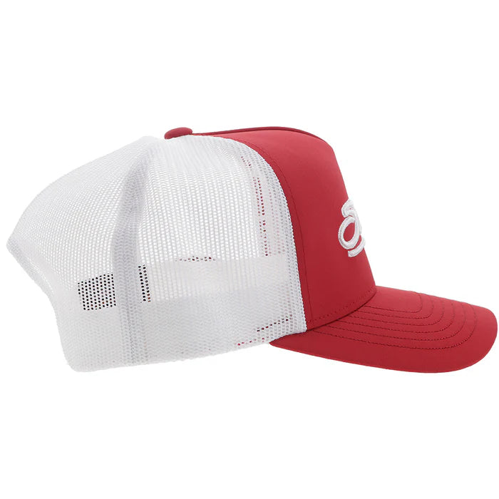 Crimson and white Snapback cap with Sooners embroidered on front with a white mesh back and Hooey logo embroidered on side. Side view stock photo.