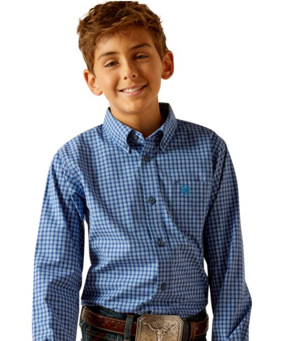 Boy's Ariat long sleeve Pro Series shirt in Blue Plaid. Front view showing shirt tucked in and stitched Ariat shield logo on left chest pocket.