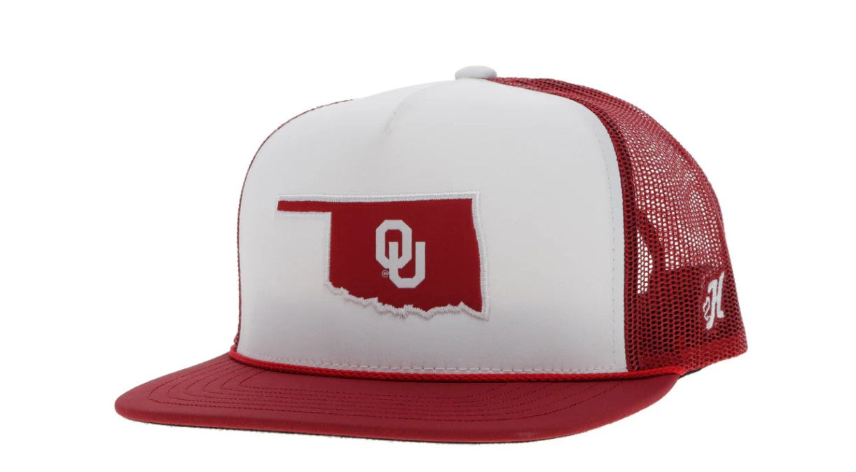 Red and white snapback cap with Oklahoma state outline and OU logo patch. Front View Stock Photo