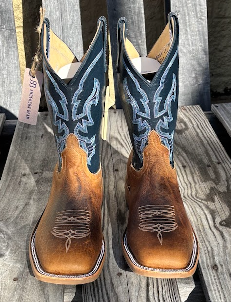 A pair of men's Anderson Bean 11 inch shaft distressed bison cowboy boots with blue kidskin tops and square toes. Front view