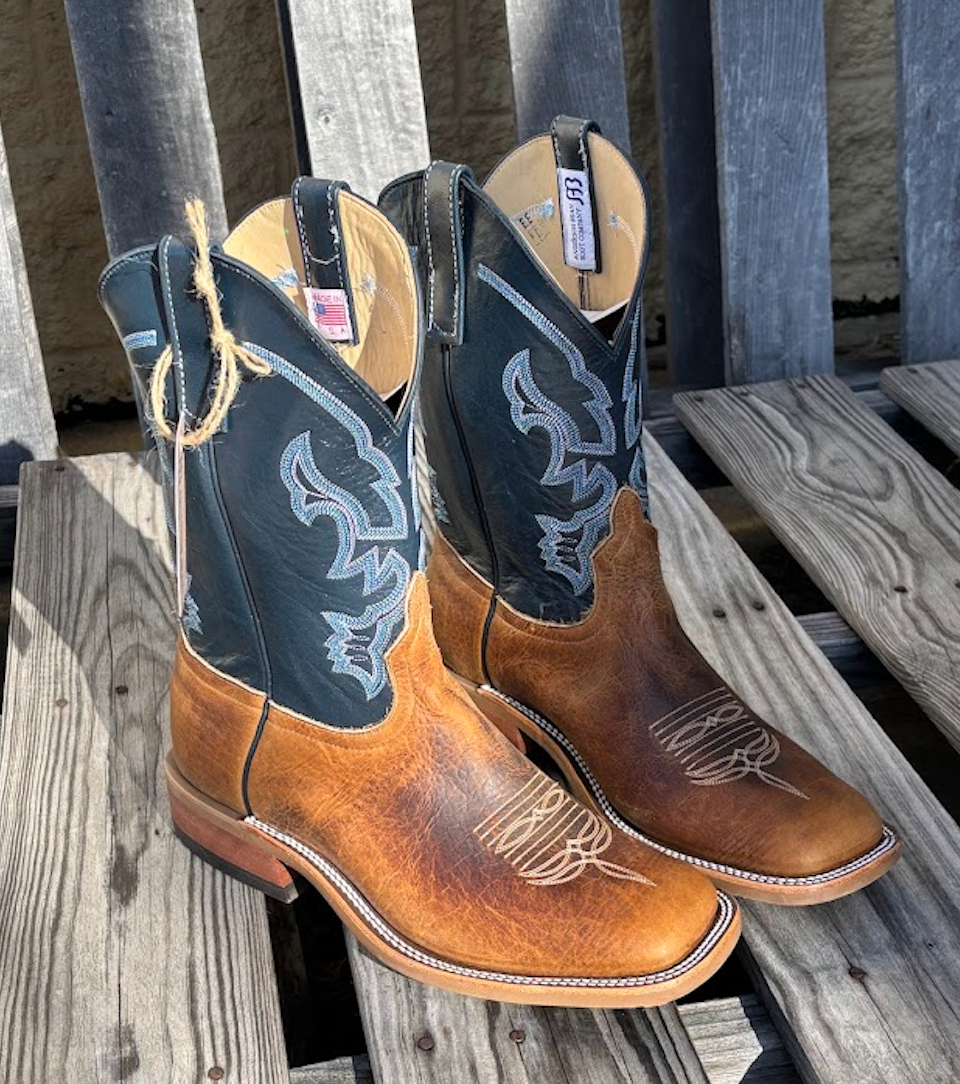 A pair of Anderson Bean 11 inch shaft distressed bison leather boots with blue kidskin tops and square toes.