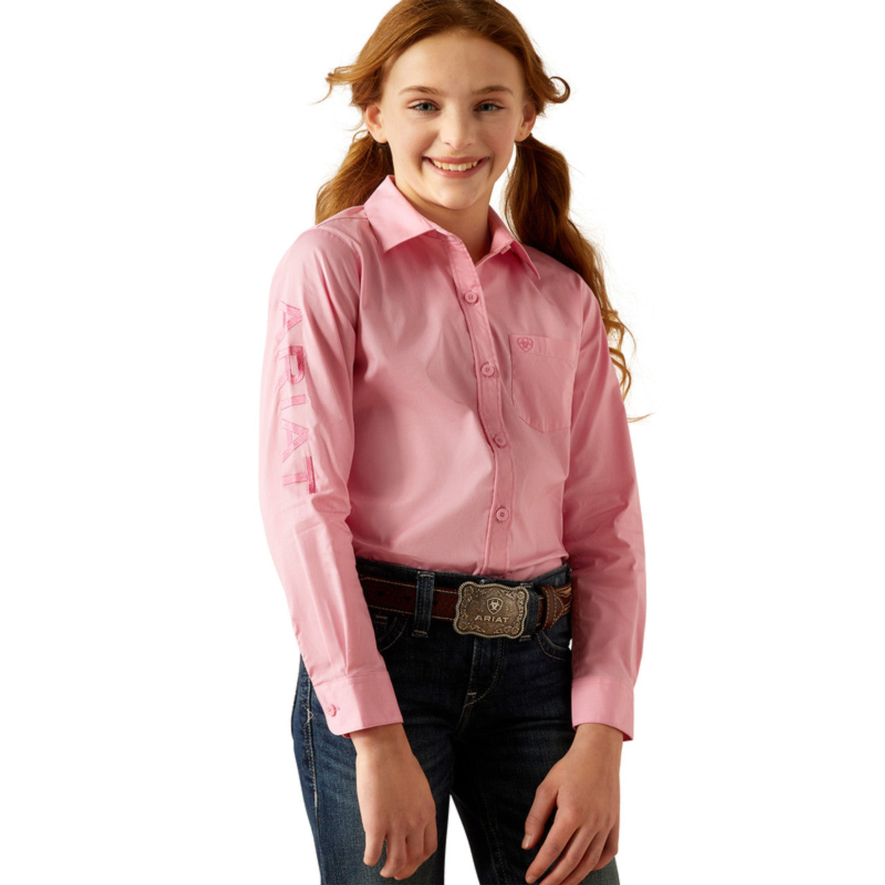 Girls Ariat long sleeve shirt in Prism Pink. This shirt has a bold Ariat logo on left sleeve.