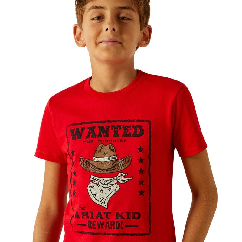 Boy's Ariat short sleeve tee in Red with a front "Wanted for Mischief" "The Ariat Kid" graphic print. Close up of graphic print on chest.