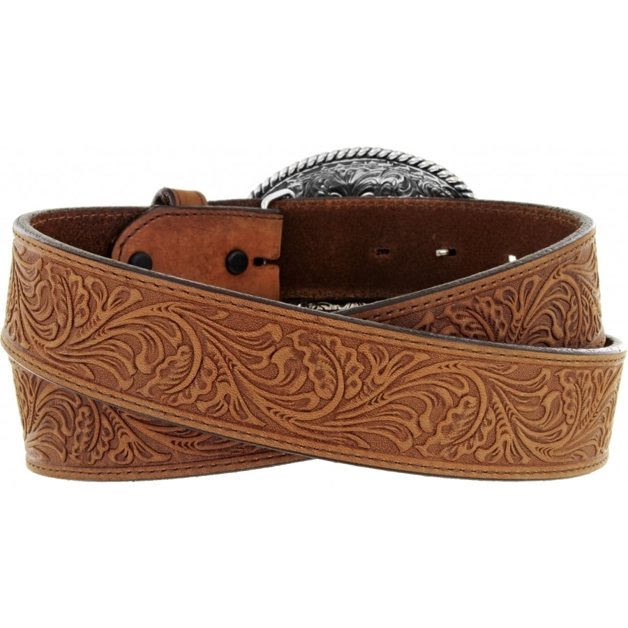 A tan Western style leather belt with a Justin Brand logo trophy buckle, featuring engraved patterns on the leather and a silver finish. Rear View