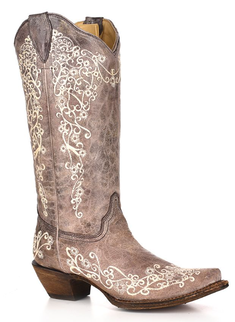 Women's brown leather snip toe boot with bone embroidery design. Profile View