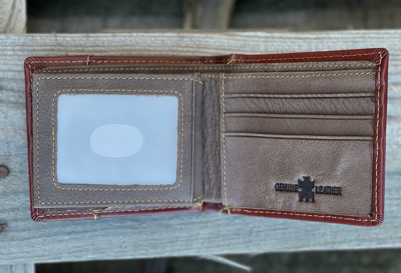 Brown bifold leather wallet with Beige inlay featuring a embossed Praying Cowboy design. Inside view showing dual ID window and multiple card slots.