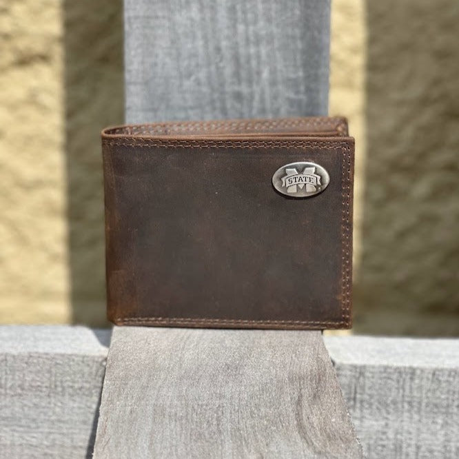 A Zep-Pro brown 'Crazy Horse' leather MSU bi-fold wallet with an "M State" logo brass concho on the top right. Front view.