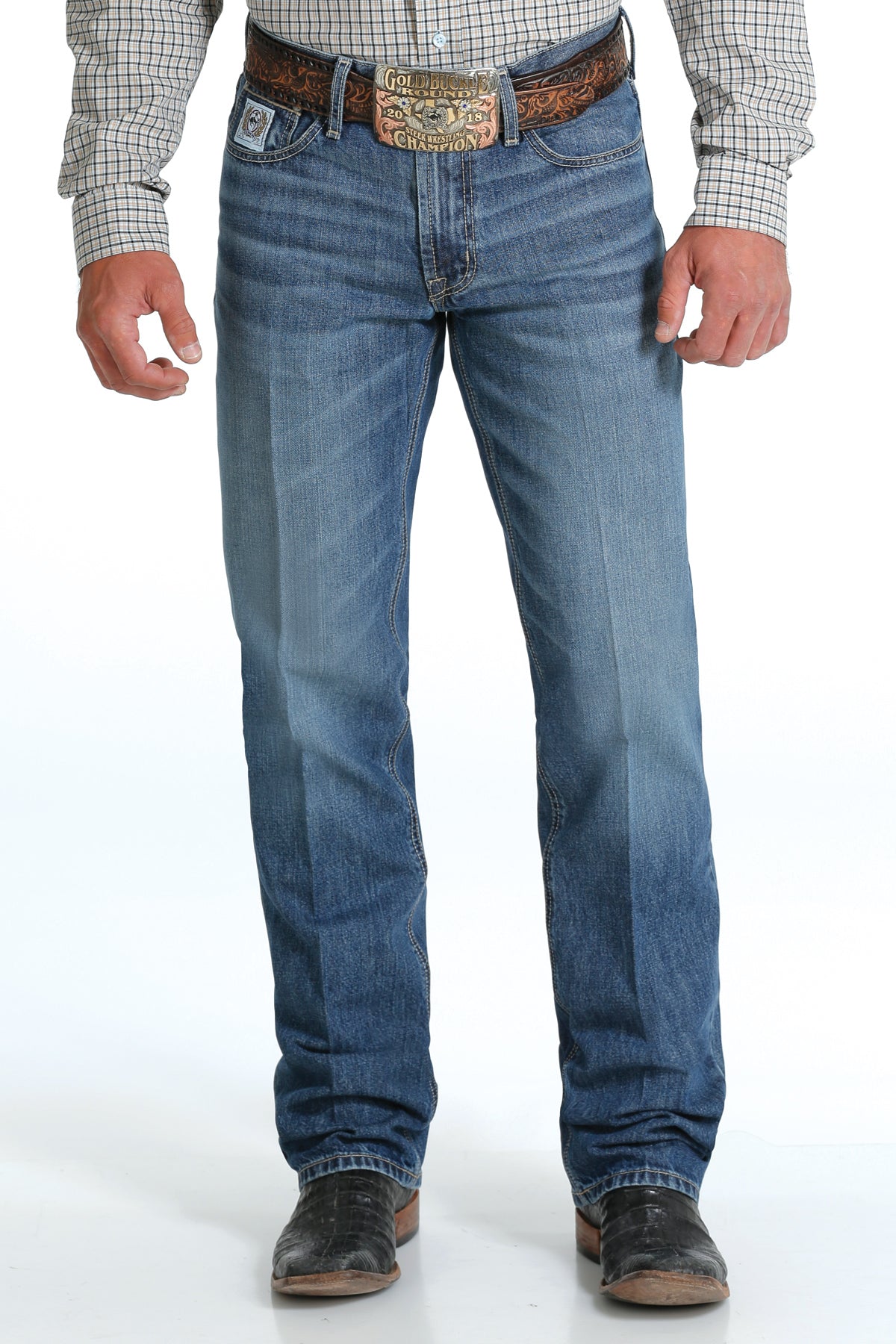 Men's White Label Light Wash jeans front view showing detail of front pockets and zipper. Also shows relaxed fit and stack on boots.