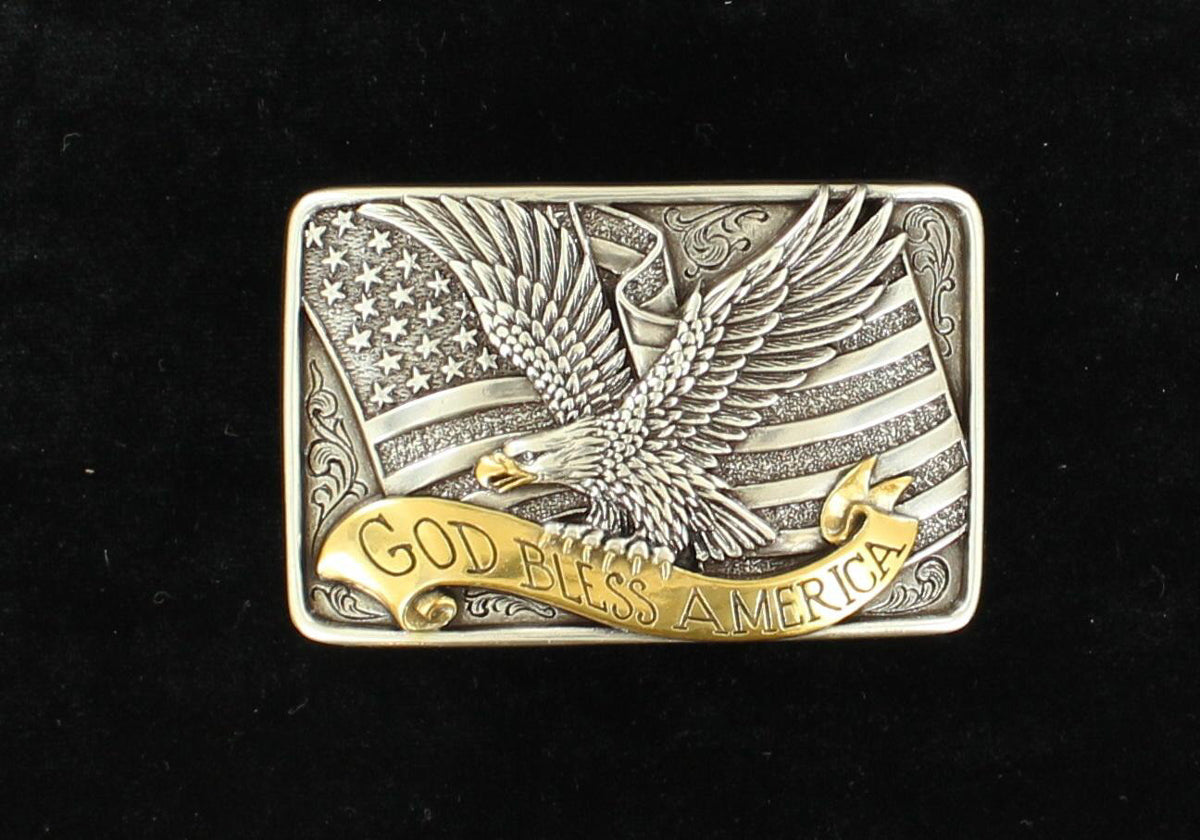 A rectangular, two-toned silver and gold belt buckle featuring an American flag and a bald eagle with the phrase 'God Bless America' written in a scroll ribbon.