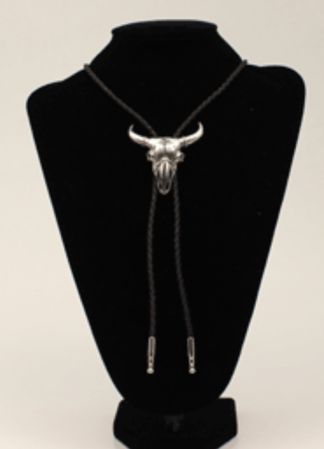 A silver-colored steer skull bolo tie with a black braided leatherette cord.