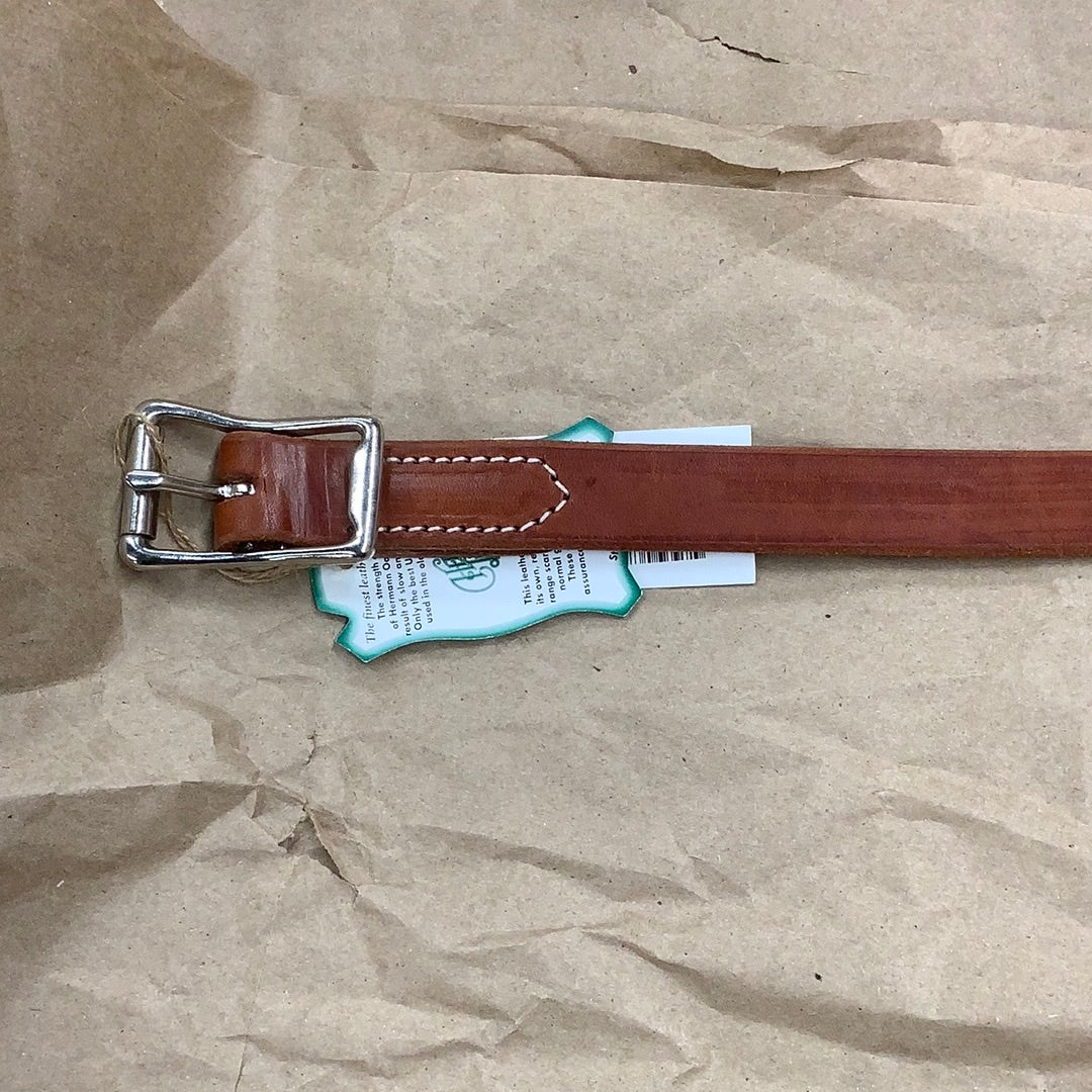 Buckle of chestnut harness leather breast collar tug.