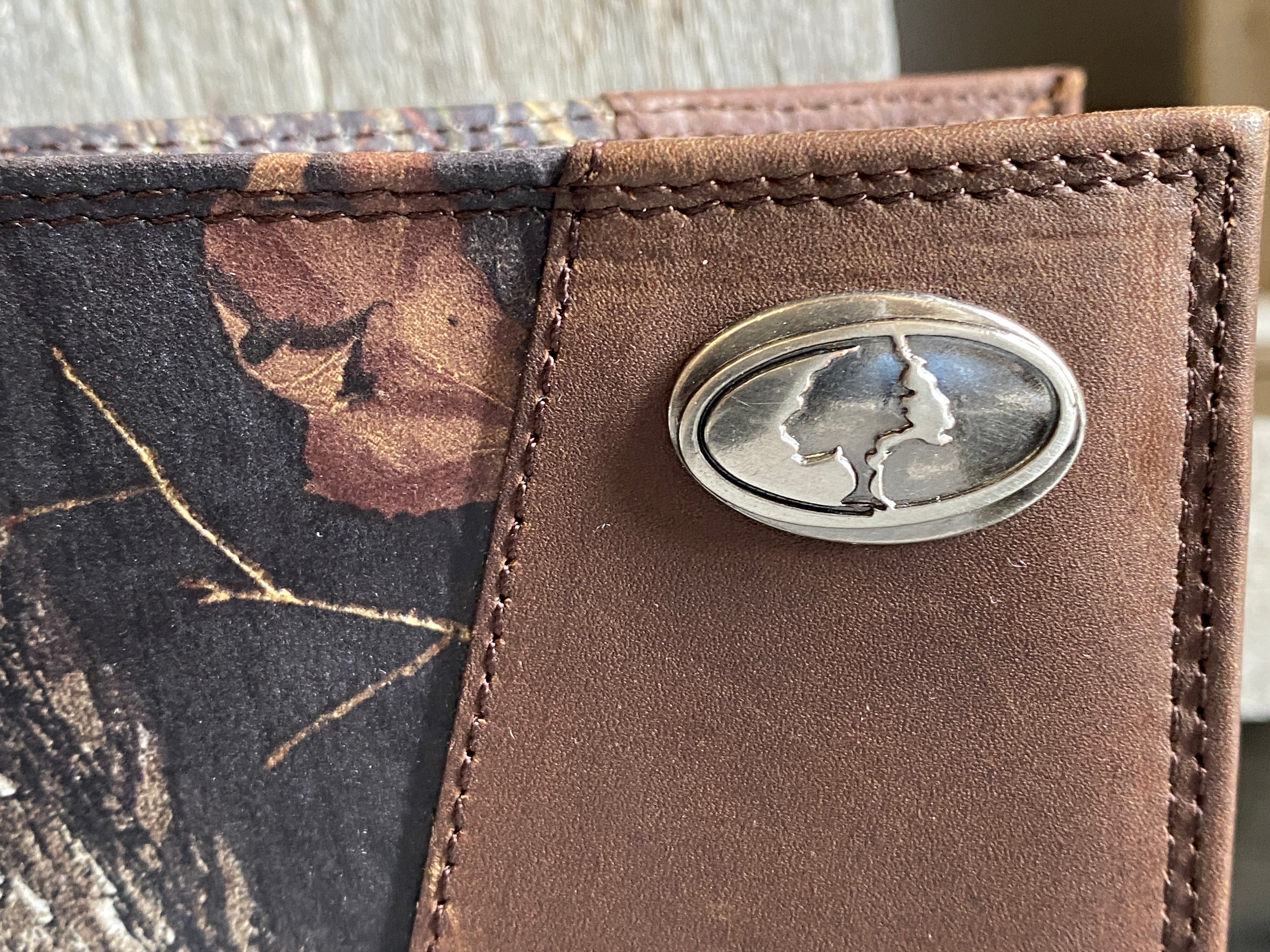 Zep-Pro 1/2 Mossy Oak Camo/Brown Leather Bi-fold Wallet front view of concho