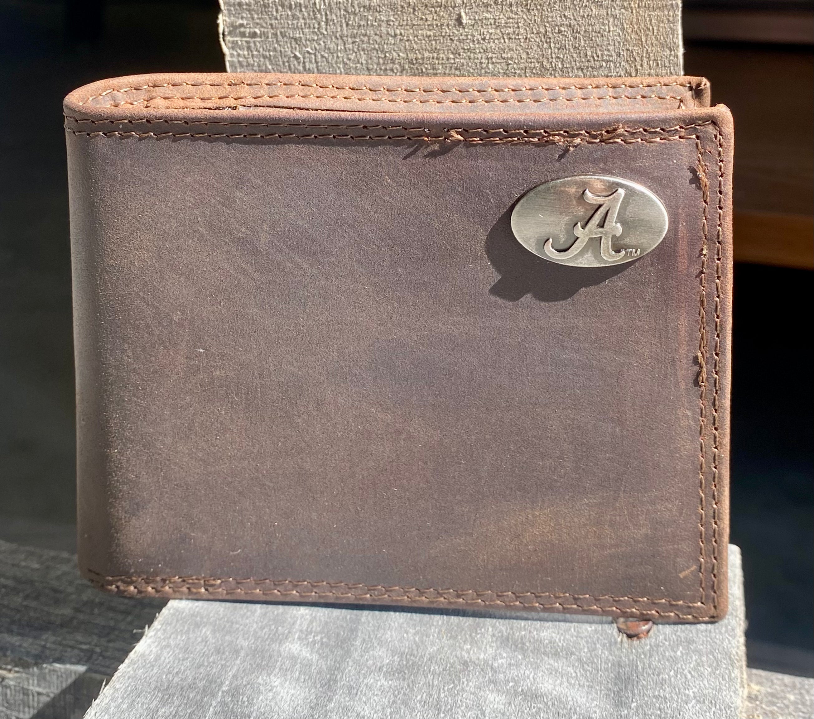 Zep-Pro brown "Crazy Horse" leather Alabama bifold wallet with an "A" logo brass concho on the top right. Front view.