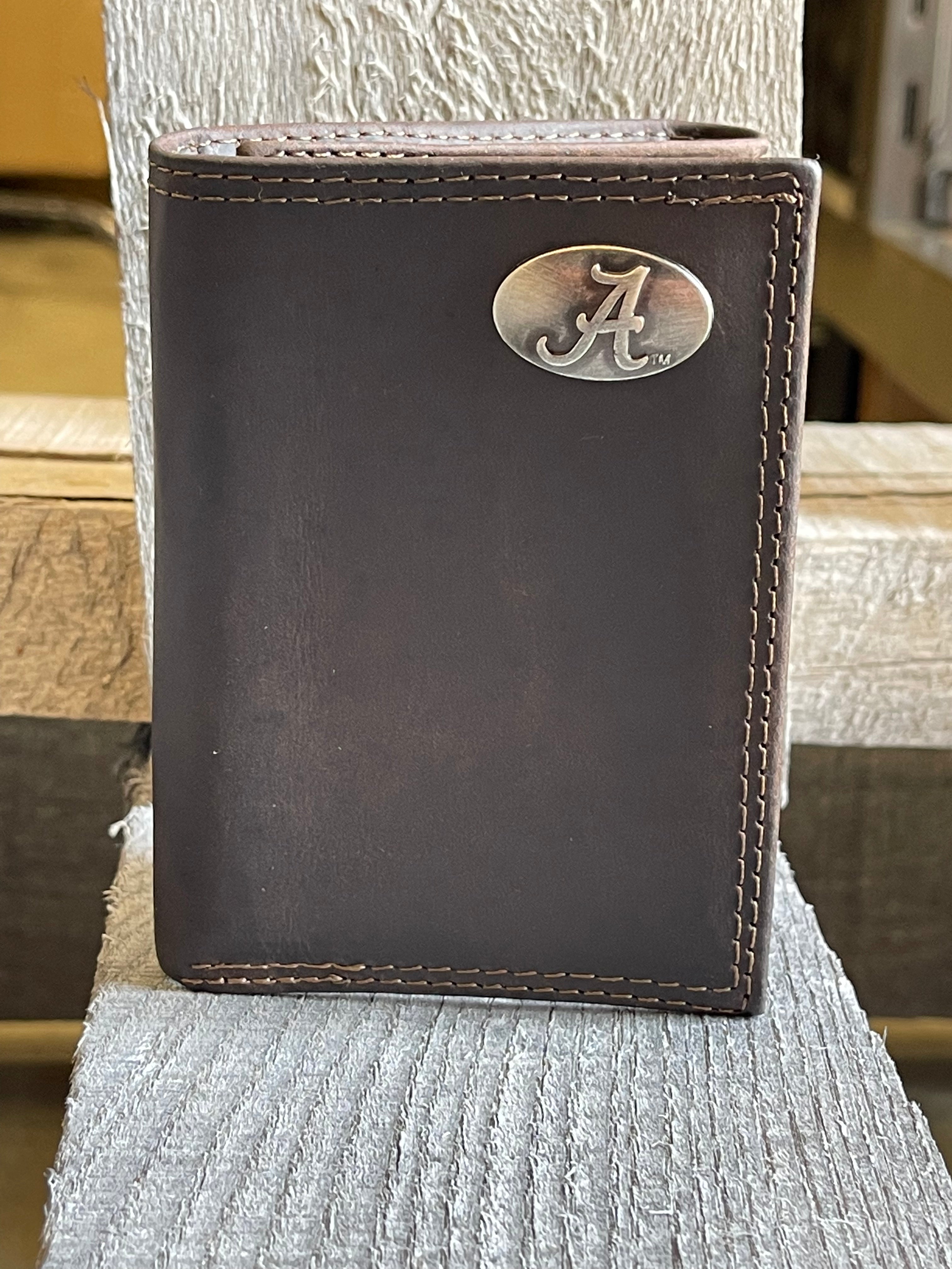 Zep-Pro brown "crazy horse" leather trifold wallet with an Alabama logo "A" brass concho on the top right. Front view.