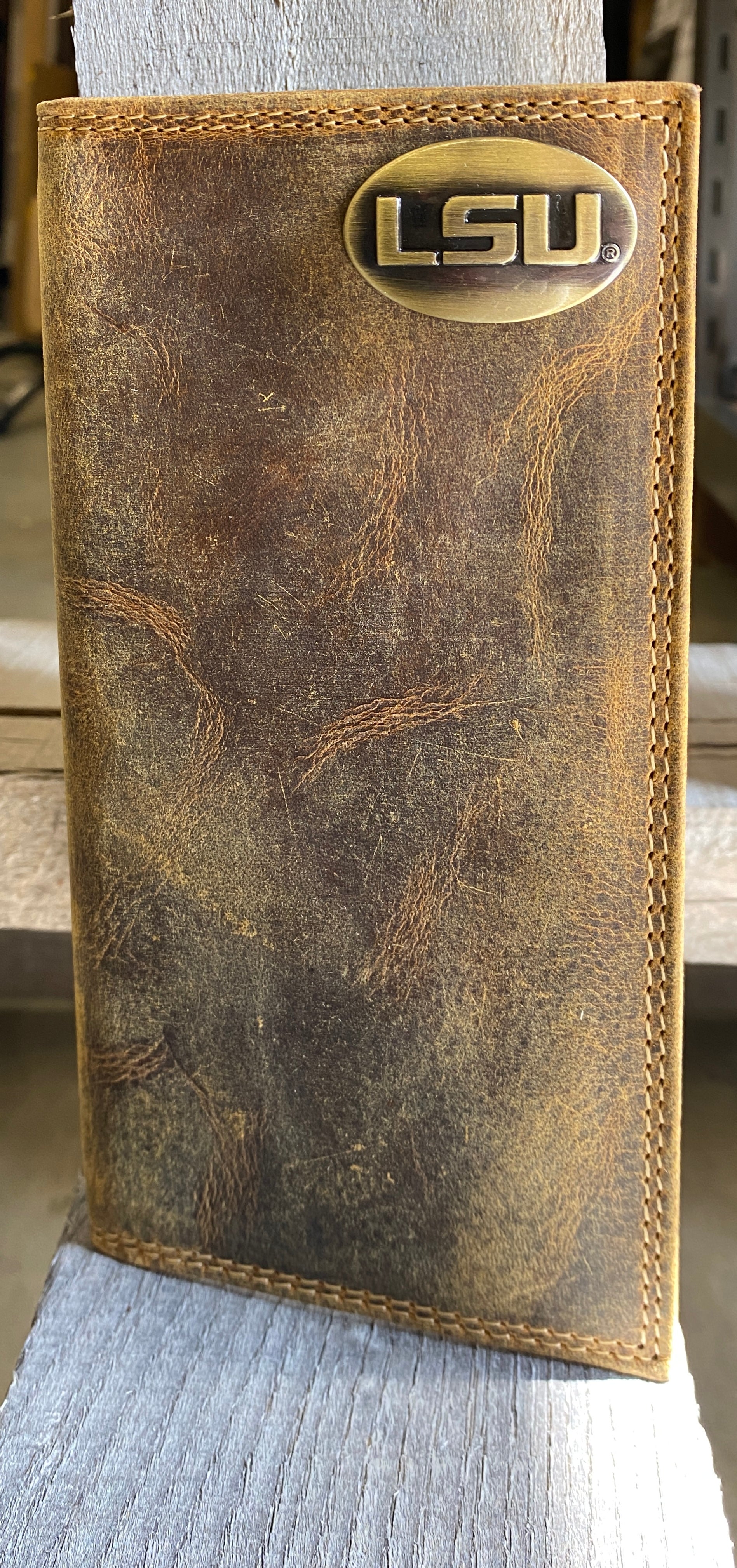 Zep Pro Louisiana State University Tigers Vintage Tan Leather Tall Wallet front view shown features brass LSU logo concho on top right.