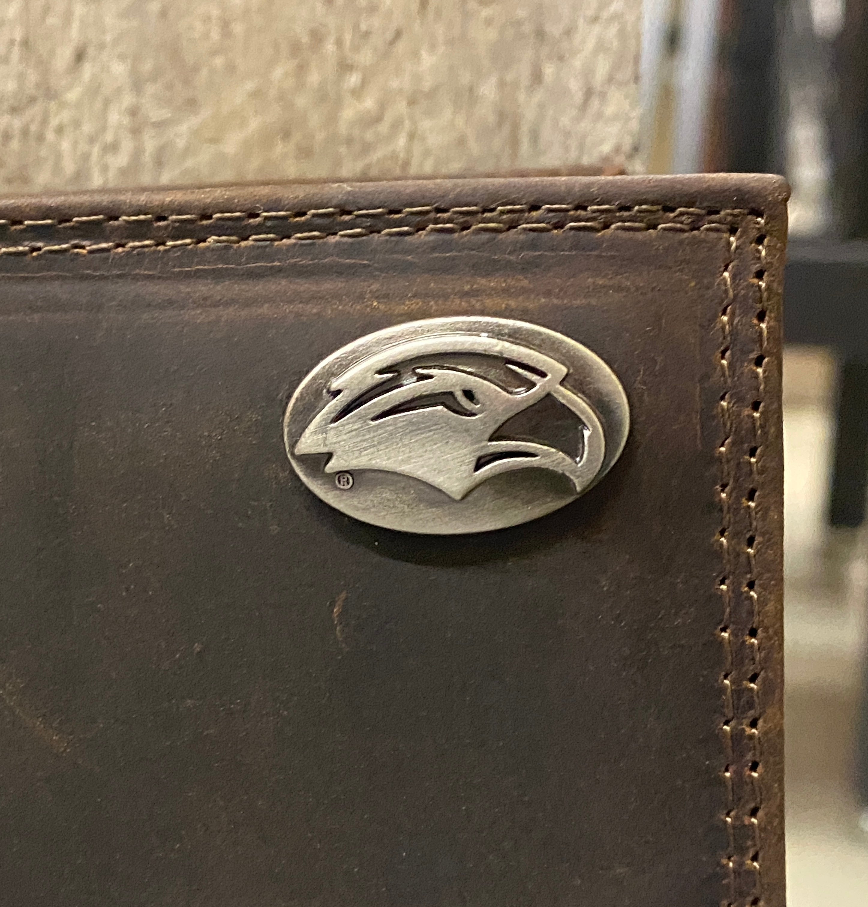 Zep-Pro University of Southern Miss Brown “Crazy Horse” Leather Bifold Wallet front view focusing on concho