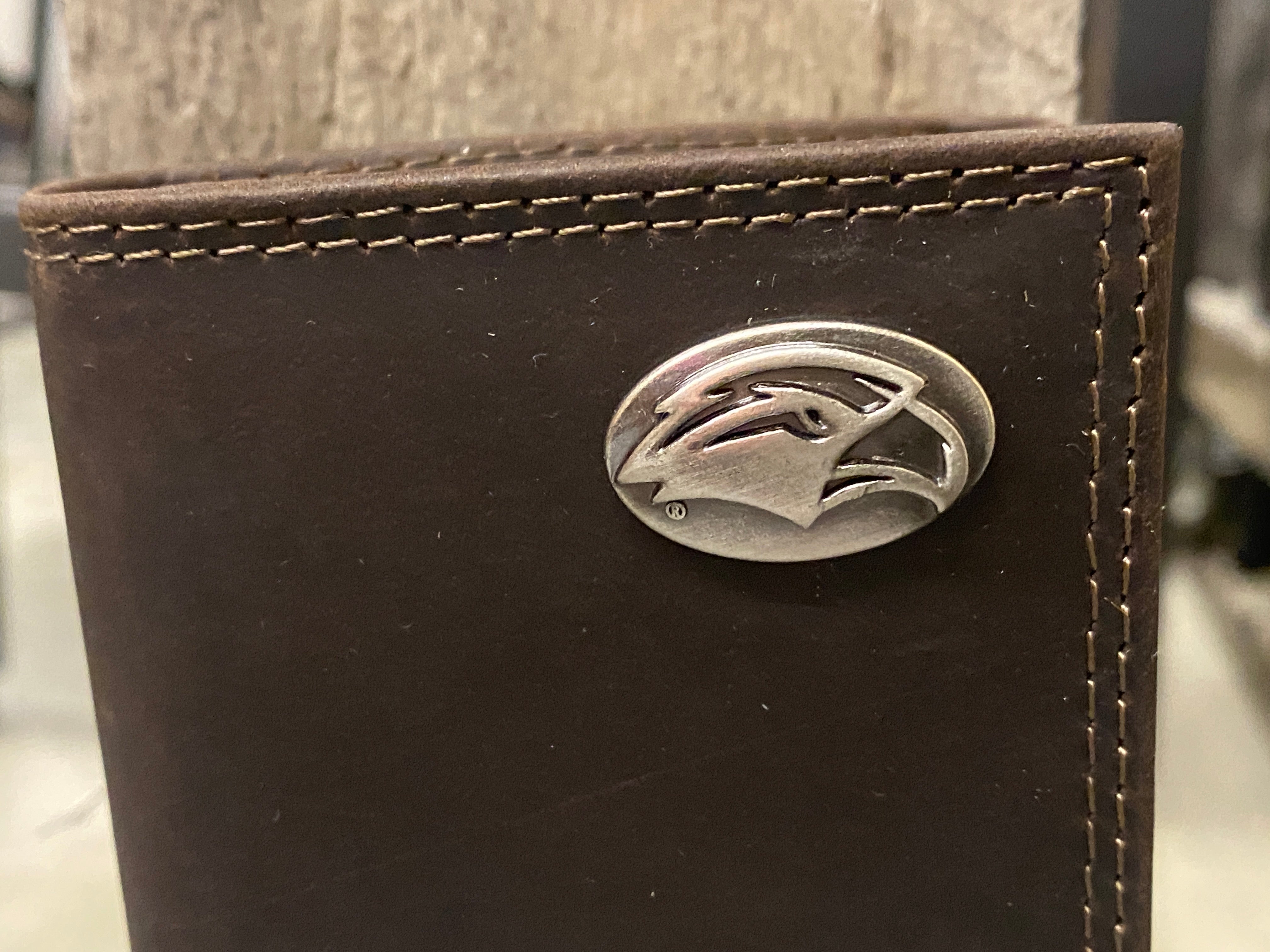 Zep-Pro University of Southern Mississippi Brown “Crazy Horse” Leather Trifold Wallet Front view focusing on concho.