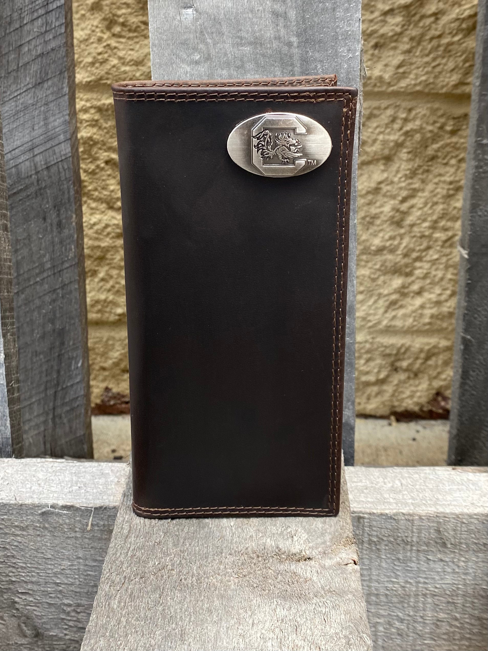 Zep-Pro University of South Carolina Gamecocks Brown “Crazy Horse” Leather Tall Wallet with brass Caroliina Gamecocks concho in upper right corner. Front view