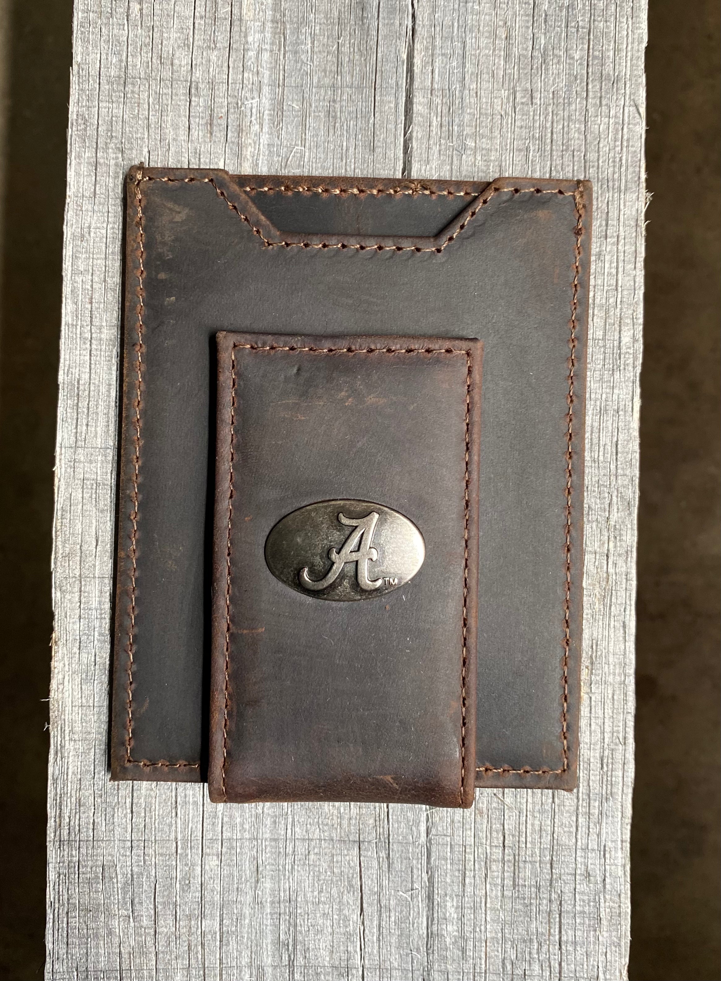 Zep Pro University of Alabama Brown “Crazy Horse” Leather Front Pocket Wallet with brass Alabama "A" logo oval concho on bill closure tab. Front view.