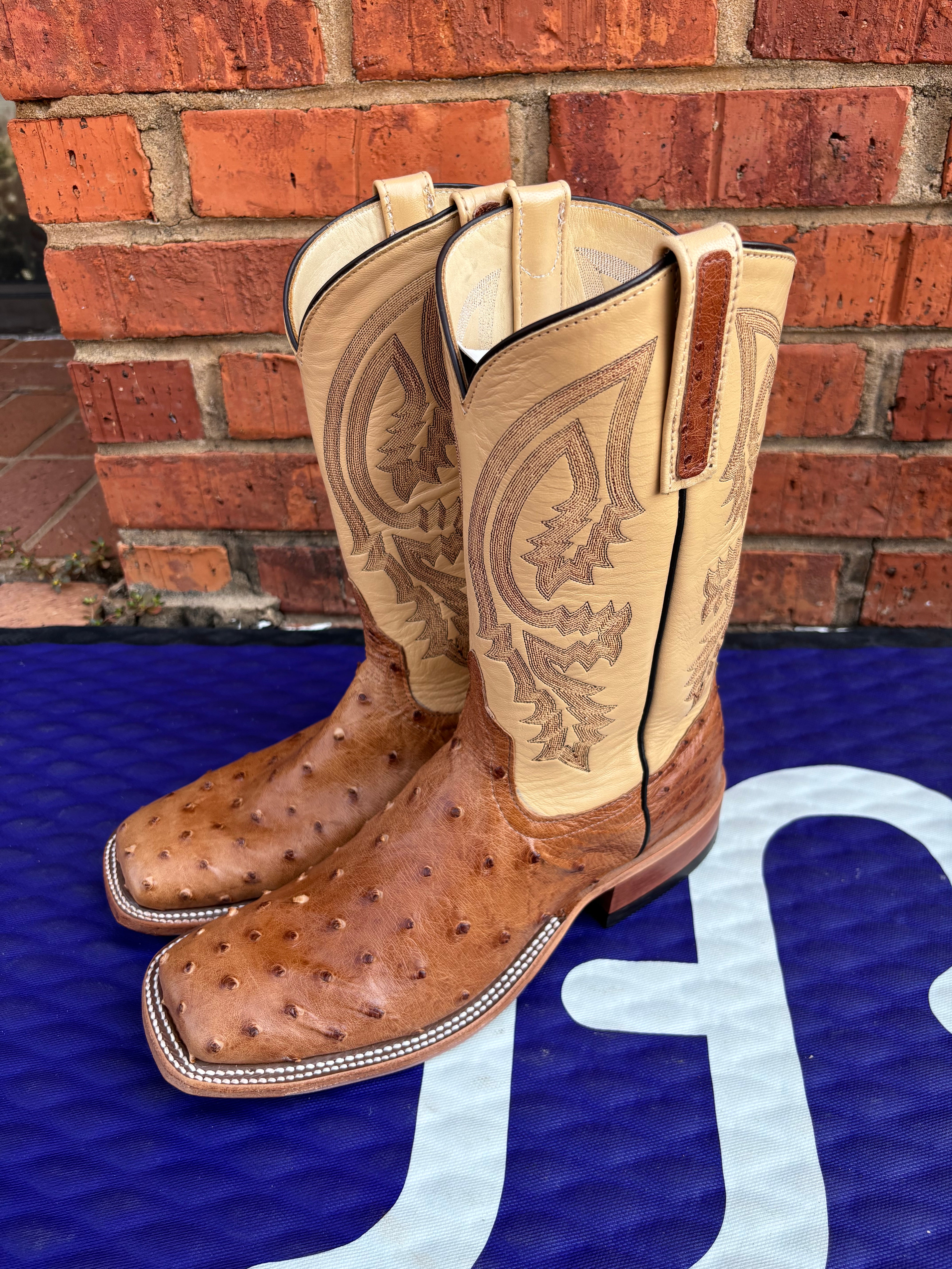 Women's Anderson Bean square toe boots in Tan Full Quill Ostrich with Dromedary Kidskin tops. Side view showing ostrich overlay on the pull straps and the intricate stitching on the shaft. 