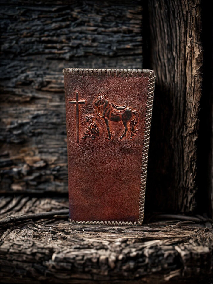 Brown leather tall wallet with whipstitch border and a embossed Praying Cowboy design. Front View 