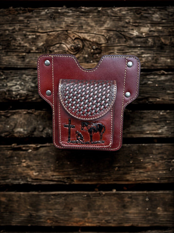 Brown leather phone case featuring a embossed Praying Cowboy design and a front pouch. Front View